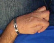 hand was clenched tightly